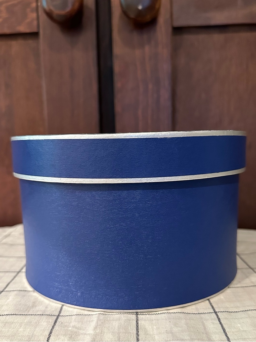Heavy cardboard • oval lidded box • in new condition • blue w/silver trim